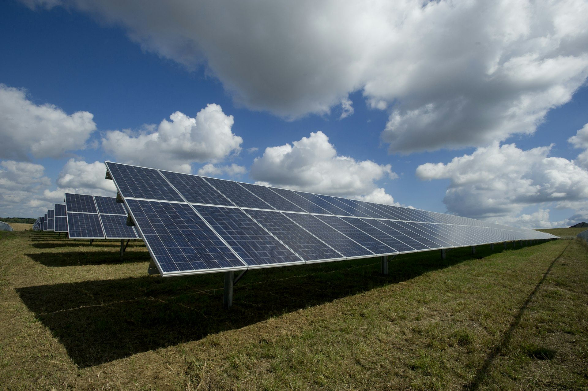Solar panels and green mountains in northern Spain at dawn